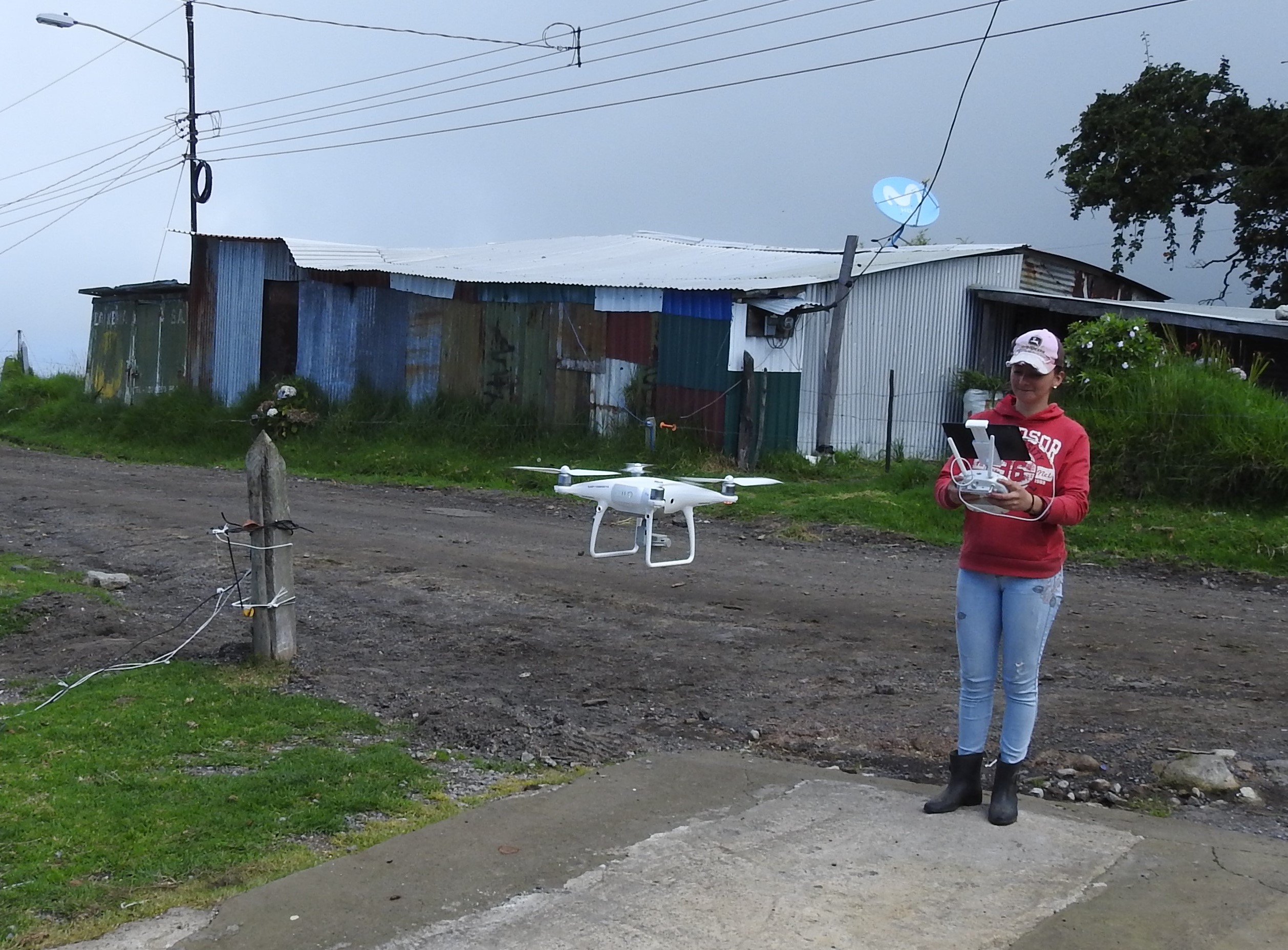 Figure 1. Participant of the Women Rally of Geospatial Technology driving a drone in her community as part of prototype tracking. Source: Molina, 2021